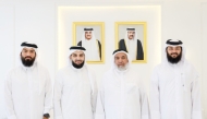 Minister of Awqaf and Islamic Affairs H E Ghanem bin Shaheen bin Ghanem Al Ghanim with other officials and Qatari contestant Yusuf Ahmed Yusuf Hassan Asheer.