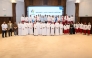 Team Qatar athletes and QOC officials pose for a group photo. 