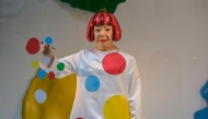 (FILE PHOTO) A life-like robot of artist Yayoi Kusama paining a window stands at the Louis Vuitton store on Fifth Avenue in New York City on January 13, 2023. (Photo by ANGELA WEISS / AFP) 