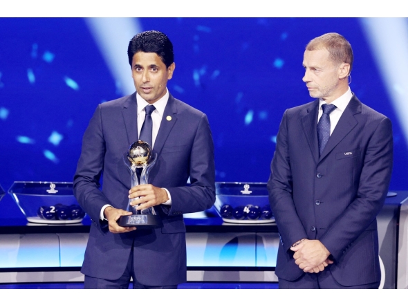 PSG President Nasser Al-Khelaifi (left) speaks after receiving an award from UEFA President Aleksander Ceferin during the draw ceremony yesterday. 