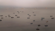 Aerial view shows anchovy fishing boats anchored off the coast in front of the Constitutional Province of Callao, Peru on August 31, 2026. (Photo by Ernesto BENAVIDES / AFP)
 