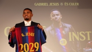 Brazilian forward Gabriel Jesus poses with his jersey during his official presentation as FC Barcelona's new football player on September 1, 2026 in Barcelona. (Photo by Lluis GENE / AFP)