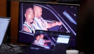 A 1996 photo of rapper Tupac Shakur (L) and Marion “Suge” Knight is shown on screens during closing arguments in the Duane Davis murder trial, related to the 1996 killing of rapper Tupac Shakur, at Clark County District Court at the Regional Justice Center in Las Vegas, Nevada, on August 31, 2026. (Photo by STEVE MARCUS / POOL / AFP)