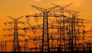 This picture taken on November 12, 2025 shows power poles near the lignite-fired power station operated by German energy giant RWE near Niederaussem, part of Bergheim, western Germany. Photo by Ina FASSBENDER / AFP
