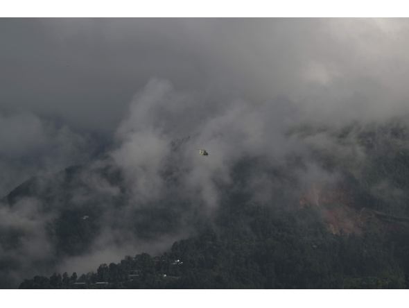 A helicopter takes off from a temporary relief camp in the aftermath of flash floods at Trishuli Bazar, Nepal's Nuwakot district, on September 6, 2026. (Photo by Prakash MATHEMA / AFP)
 