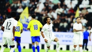Al Sadd's Akram Afif (second right) celebrates after scoring a goal.