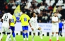 Al Sadd's Akram Afif (second right) celebrates after scoring a goal.