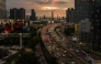 Commuters drive past commercial and residential buildings during the early evening rush hour traffic in Bangkok on September 4, 2026. (Photo by Anthony WALLACE / AFP)
