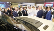 Officials talking with participants at the second edition of the Autonomous e-Mobility Forum, which opened in Doha, yesterday.