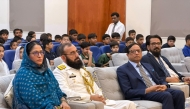 Defence Attaché, Embassy of Pakistan to Qatar Commodore Sher Wali Khan and PISQ Principal Ch Muhammad Afzal with officials and guests during the event.