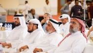Minister of Awqaf and Islamic Affairs H E Ghanem bin Shaheen bin Ghanem Al Ghanim (second right) with other officials during the event.
