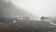This handout photo taken on September 9, 2026 and received from Shizuoka prefecture on September 10, 2026 shows vehicles buried by mud and debris after a landslide swept into the parking lot at Fifth Station of Mount Fuji's Fujinomiya Trail in Fujinomiya, Shizuoka Prefecture. (Photo by Shizuoka Prefecture / AFP)