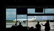 (FILES) A Myanmar Airways International passenger plane is parked at the Mandalay International Airport in Mandalay on September 18, 2025.  (Photo by Sai Aung MAIN / AFP)