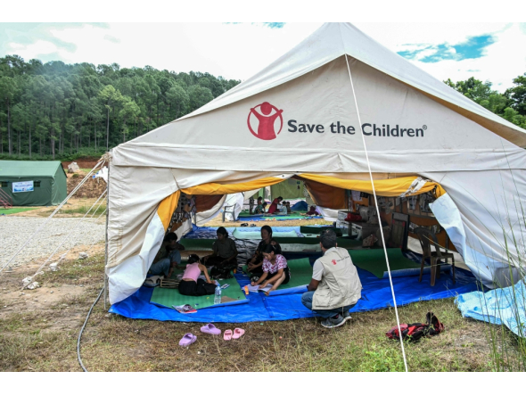 Children, separated from their parents from the flash floods, study at a temporary learning centre run by Save the Children charity in Nepal's Nuwakot district on September 11, 2026. (Photo by Prakash Mathema / AFP) 