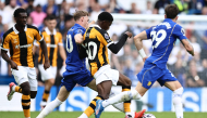 Chelsea's English midfielder Cole Palmer (2L) tackles Hull City's French striker #50 Mohamed-Ali Cho during the English Premier League football match between Chelsea and Hull City at Stamford Bridge in London on September 12, 2026. (Photo by Henry NICHOLLS / AFP) 