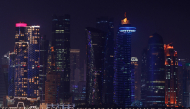 The skyline of illuminated high-rise buildings is seen along the Corniche Promenade in Doha on September 4, 2026. (Photo by Karim Jaafar / AFP)
