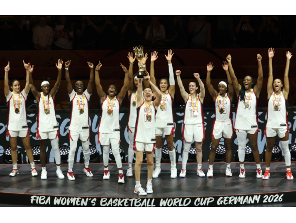 US' power forward #10 Breanna Stewart lifts the trophy after winning with her team the 2026 FIBA Women Basketball World Cup final game against France in Berlin on September 13, 2026. (Photo by Odd ANDERSEN / AFP)
