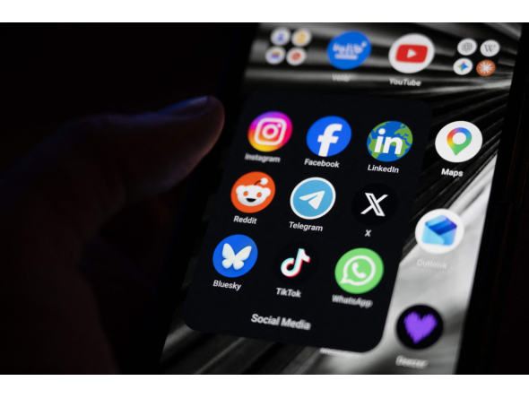 This photograph shows a set up smart-phone screen displaying the logo of main social media platforms including Instagram, Facebook, LinkedIn, Reddit, Telegram, X, Bluesky, Tiktok and Whatsapp in Saint-Mande, east of Paris, on April 29, 2026. Photo by Martin LELIEVRE / AFP