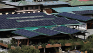 This photograph taken on August 30, 2026, shows solar panels on rooftops of buildings in Bhutan's capital city of Thimphu. (Photo by Niharika Kulkarni / AFP)
