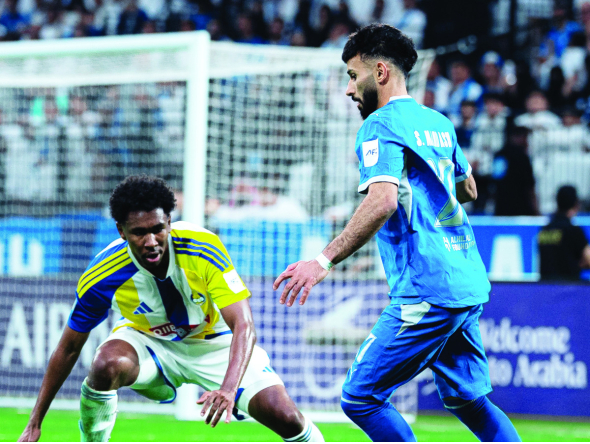Action during the match between Al Gharafa and Al Hilal.