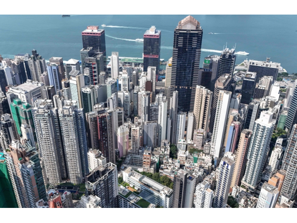 An aerial view shows high-rise buildings in the Central district of Hong Kong on September 16, 2026. (Photo by Peter Parks / AFP)
