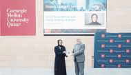 Minister of Social Development and Family H E Buthaina bint Ali Al-Jabr Al-Nuaimi receiving a memento from Dean of CMU-Q Michael Trick. 