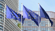 This photograph shows the European flags flapping in the breeze in front of the Louise Weiss building headquarters of the European Parliament, in Strasbourg, eastern France on September 17, 2026. (Photo by Jean-Christophe VERHAEGEN / AFP)