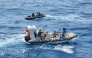 This handout picture taken on September 17, 2026, and released on September 18, 2026 by the Indonesian Navy shows navy personnel maneuvering their boats directly above the passenger ship Virgo Transport 8 which capsized in the Java Sea waters. (Photo by Handout / INDONESIAN NAVY / AFP)