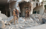 Army personnel stand amid the rubble following an explosion inside the police headquarters at Kohat in Pakistan's Khyber Pakhtunkhwa province on September 18, 2026. (Photo by Basit Shah / AFP)