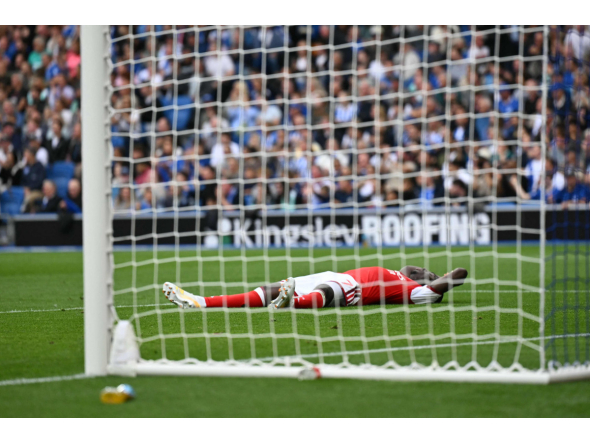 Arsenal's English midfielder #07 Bukayo Saka reacts after failing to score during the English Premier League football match between Brighton and Hove Albion and Arsenal at the American Express Community Stadium in Brighton, southern England on September 19, 2026. (Photo by Glyn KIRK / AFP)