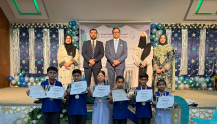Chief Guest Alumnus of PISQ and also Active Member of board of governors of PISQ Ali Sikandar, Principal Ch Muhammad Afzal, and Vice Principals with the students who received academic achievement certificates during the event.