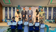 Chief Guest Alumnus of PISQ and also Active Member of board of governors of PISQ Ali Sikandar, Principal Ch Muhammad Afzal, and Vice Principals with the students who received academic achievement certificates during the event.