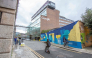  Members of the public pass the offices of Google in the business and financial sector of Dublin, Ireland on October 7, 2021. Photo by PAUL FAITH / AFP