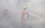 Firefighters extinguish forest and land fires in Banjar, South Kalimantan, on September 21, 2026. (Photo by Muda Sagala / AFP)