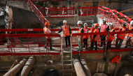 Paris Mayor Emmanuel Gregoire (2nd L) and France's Culture Minister Catherine Pegard (4th L) visit an archaeological site following the discovery of a Gallo-Roman era wall of Lutetia under the Hotel-Dieu hospital on the Ile de la Cite in central Paris, on September 22, 2026. (Photo by SIMON WOHLFAHRT / AFP)
