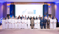 President of UDST Dr. Salem Al-Naemi with other officials and honourees during the ceremony.