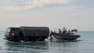 In this undated handout photograph released by the Kazakh Defence Ministry on September 25, 2026, Kazakh military personnel conduct search and rescue operations at an undisclosed location in the waters of the Caspian Sea. Photo by Handout / KAZAKH DEFENCE MINISTRY / AFP