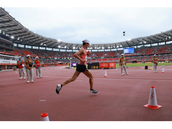 Japan's Ichitaka Yamashita enters the stadium during the 2026 Asian Games at Nagoya City Mizuho Park Athletic Stadium in Nagoya, Aichi Prefecture on September 26, 2026. (Photo by David Gray / AFP)