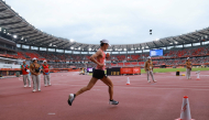 Japan's Ichitaka Yamashita enters the stadium during the 2026 Asian Games at Nagoya City Mizuho Park Athletic Stadium in Nagoya, Aichi Prefecture on September 26, 2026. (Photo by David Gray / AFP)