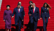 First lady of China Peng Liyuan, President of China Xi Jinping, U.S. President Donald Trump and first lady Melania Trump depart the National Archives Museum following a tour on September 25, 2026 in Washington, DC.  (Photo by Win McNamee/Getty Images/AFP)