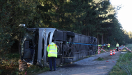 Emergency services and firefighters work at the site of a bus accident near Buchloe-Ost, southern Germany, early on September 27, 2026, where the coach had overturned on the A96 motorway. Photo by Karl-Josef Hildenbrand / dpa / AFP