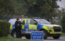 Armed police man a roadblock while posted outside RAF Fairford base in Fairford, south-west England on September 27, 2026, as UK counter-terrorism police investigate an incident near the base in the village of Whelford. Photo by JUSTIN TALLIS / AFP