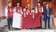 Qatar Chess Association President Mohammed Al Mudahka poses for a photo with the Qatar chess team which won the gold medal  at the 46th World Chess Olympiad in Samarkand, Uzbekistan.