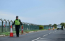 Police continue to man a roadblock outside RAF Fairford base (L) in Fairford, south-west England on September 28, 2026. (Photo by Ben Stansall / AFP)