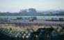 An armoured vehicle (C) patrols the interior at RAF Fairford base in Fairford, south-west England on September 28, 2026. (Photo by Ben Stansall / AFP)