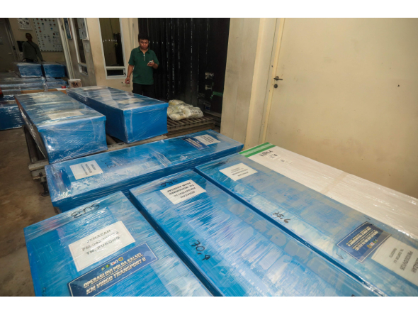 Coffins containing the identified remains of victims from the Virgo 8 ship disaster are prepared for repatriation to their respective hometowns at Syamsudin Noor Airport in Banjarbaru, South Kalimantan province, Indonesia on September 28, 2026. (Photo by MUDA SAGALA / AFP)