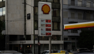 This photograph shows a digital board displaying fuel prices near a filling station in Athens on September 30, 2026. (Photo by Angelos TZORTZINIS / AFP)