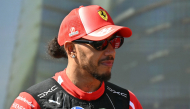 Ferrari's British driver Lewis Hamilton attends the drivers' presentation prior to the Formula One Azerbaijan Grand Prix at the Baku City Circuit in Baku on September 26, 2026. (Photo by Andrej ISAKOVIC / AFP)
