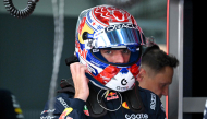 Red Bull Racing's Dutch driver Max Verstappen wears his helmet ahead of the second practice session ahead of the Formula One Bahrain Grand Prix in Sepang on October 2, 2026. (Photo by Jade Gao / AFP)