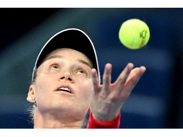:Kazakhstan Elena Rybakina serves to Armenia Alina Charaeva during their women singles match at the China Open tennis tournament in Beijing on October 3, 2026. (Photo by GREG BAKER / AFP)